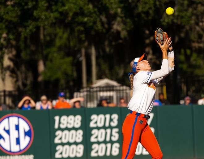 Florida Gators infielder Skylar Wallace (17) catches a fly ball for an out in the top of the first. The Florida women’s softball team hosted FSU at Katie Seashole Pressly Stadium in Gainesville, FL on Wednesday, May 3, 2023. The Seminoles defeated the Gators 8-7.  [Doug Engle/Gainesville Sun]