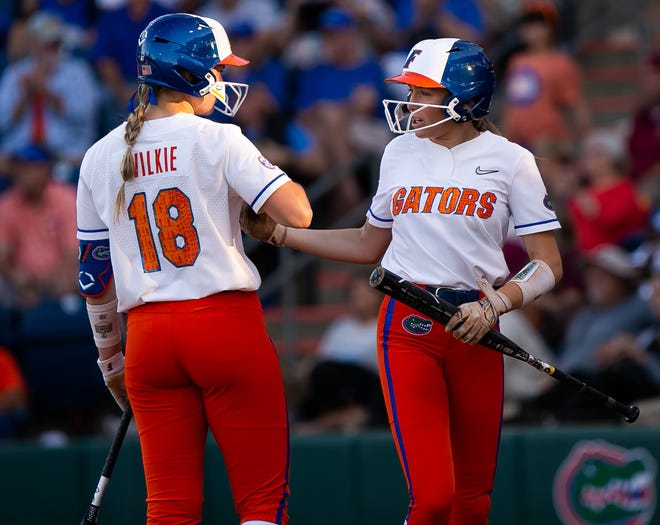 Florida Gators utility Emily Wilkie (18) congratulates Florida Gators outfielder Kendra Falby (27) after she scored a run in the bottom of the third. The Florida women’s softball team hosted FSU at Katie Seashole Pressly Stadium in Gainesville, FL on Wednesday, May 3, 2023. The Seminoles defeated the Gators 8-7.  [Doug Engle/Gainesville Sun]