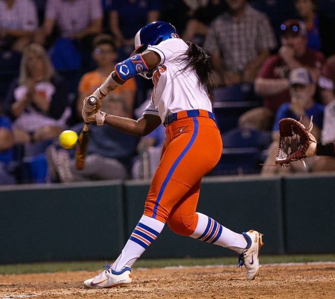 Florida Gators catcher Sam Roe (13) hits a single in the bottom of the seventh. The Florida women’s softball team hosted FSU at Katie Seashole Pressly Stadium in Gainesville, FL on Wednesday, May 3, 2023. The Seminoles defeated the Gators 8-7.  [Doug Engle/Gainesville Sun]