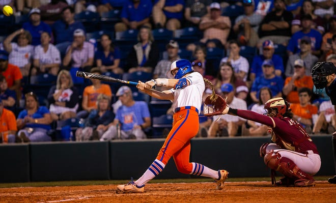 Florida Gators utility Sarah Longley (52) hits a two run homer in the bottom of the fifth. The Florida women’s softball team hosted FSU at Katie Seashole Pressly Stadium in Gainesville, FL on Wednesday, May 3, 2023. The Seminoles defeated the Gators 8-7.  [Doug Engle/Gainesville Sun]