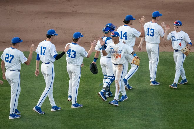 Florida's infielder Josh Rivera (24, center) celebrates with teammates after they beat FAMU 3-0 in NCAA Regionals, Friday, June 2, 2023, at Condron Family Ballpark in Gainesville, Florida. ItÕs the first shut-out for the Gators in postseason play since 2017. The Gators face Texas Tech Saturday. [Cyndi Chambers/ Gainesville Sun] 2023
