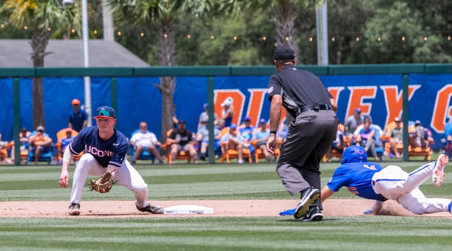Gators outfielder Michael Robertson (11) steals second in the bottom of the seventh against U Conn in NCAA Regionals, Sunday, June 4, 2023, at Condron Family Ballpark in Gainesville, Florida. Florida beat U Conn 8-2. [Cyndi Chambers/ Gainesville Sun] 2023
