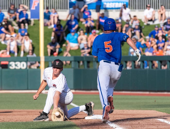 Texas Tech infielder Gavin Kash (13)] gets Florida infielder Colby Halter (5) out at first in Round 2 of NCAA Regionals, Saturday, June 3, 2023, at Condron Family Ballpark in Gainesville, Florida. The Gators fell to the Red Raiders 5-4. They will face U Conn Sunday. [Cyndi Chambers/ Gainesville Sun] 2023