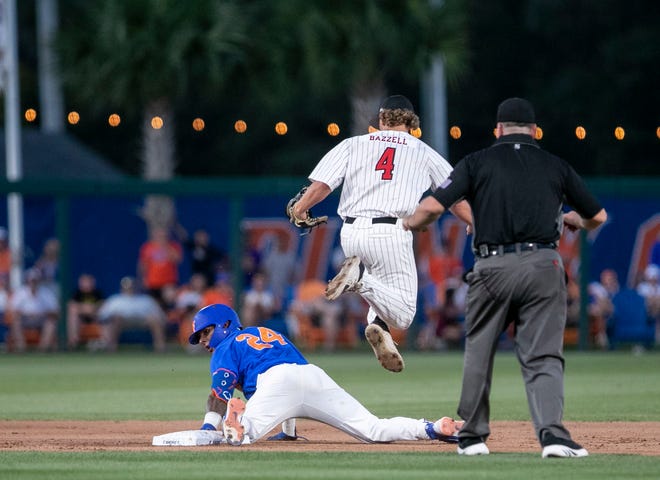 Florida infielder Josh Rivera (24) is safe at second as Texas Tech catcher Kevin Bazzell (4) leaps over him in Round 2 of NCAA Regionals, Saturday, June 3, 2023, at Condron Family Ballpark in Gainesville, Florida. The Gators fell to the Red Raiders 5-4. They will face U Conn Sunday. [Cyndi Chambers/ Gainesville Sun] 2023