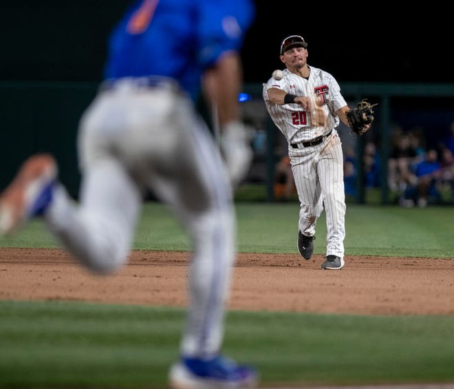 Texas Tech infielder Austin Green (20) with the throw to first for the out on Florida in Round 2 of NCAA Regionals, Saturday, June 3, 2023, at Condron Family Ballpark in Gainesville, Florida. The Gators fell to the Red Raiders 5-4. They will face U Conn Sunday. [Cyndi Chambers/ Gainesville Sun] 2023