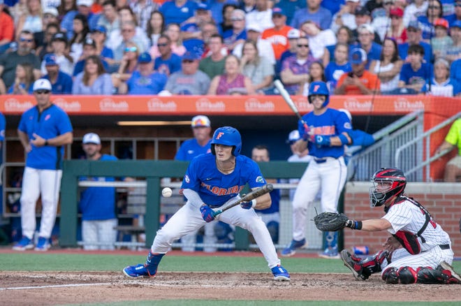 Florida outfielder Michael Robertson (11) with a bunt base hit against Texas Tech in Round 2 of NCAA Regionals, Saturday, June 3, 2023, at Condron Family Ballpark in Gainesville, Florida. The Gators fell to the Red Raiders 5-4. They will face U Conn Sunday. [Cyndi Chambers/ Gainesville Sun] 2023
