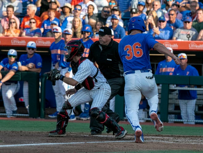 Florida utility Wyatt Langford (36) scores a run on Texas Tech in Round 2 of NCAA Regionals, Saturday, June 3, 2023, at Condron Family Ballpark in Gainesville, Florida. The Gators fell to the Red Raiders 5-4. They will face U Conn Sunday. [Cyndi Chambers/ Gainesville Sun] 2023