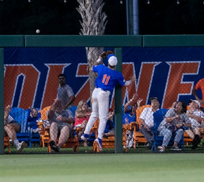 Florida outfielder Michael Robertson (11) watches as Texas Tech infielder Gavin KashÕs (13) ball goes over the fence in Round 2 of NCAA Regionals, Saturday, June 3, 2023, at Condron Family Ballpark in Gainesville, Florida. The Gators fell to the Red Raiders 5-4. They will face U Conn Sunday. [Cyndi Chambers/ Gainesville Sun] 2023