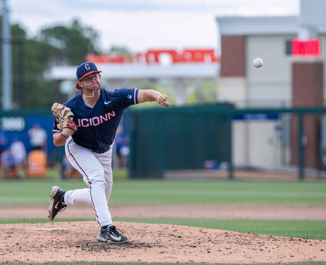 Huskies Zach Fogell (12) pitches in relief in the bottom of the fourth inning against Florida in NCAA Regionals, Sunday, June 4, 2023, at Condron Family Ballpark in Gainesville, Florida. Florida beat U Conn 8-2. [Cyndi Chambers/ Gainesville Sun] 2023