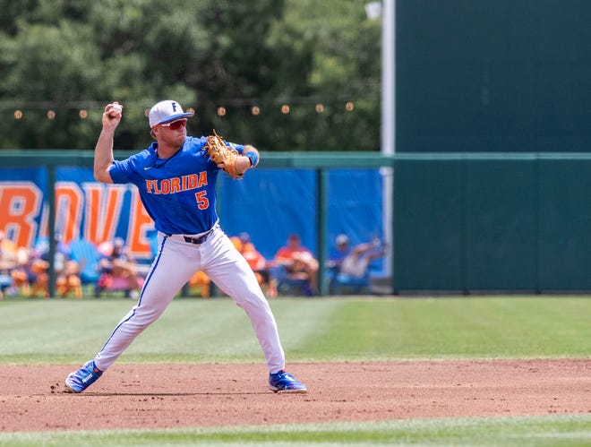 Gators infielder Colby Halter (5) with the throw to first in the top of the second inning against U Conn in NCAA Regionals, Sunday, June 4, 2023, at Condron Family Ballpark in Gainesville, Florida. Florida beat U Conn 8-2. [Cyndi Chambers/ Gainesville Sun] 2023