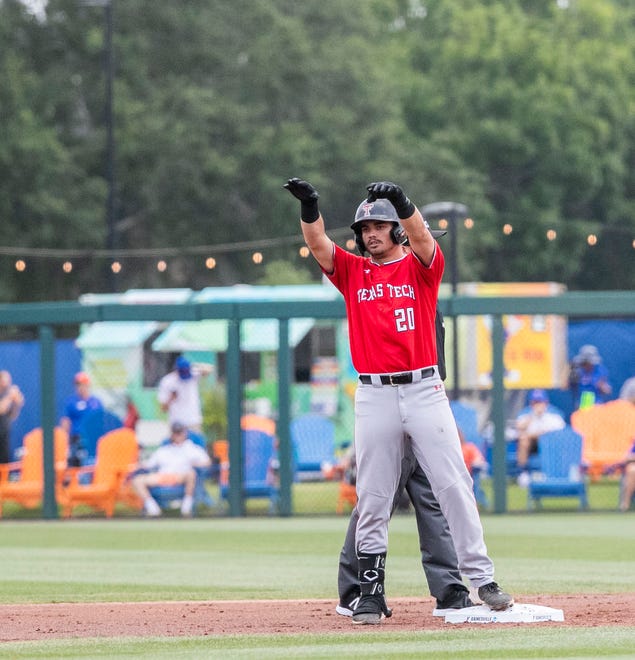Red Raiders infielder Austin Green (20) with a double against the Gators in a win-all elimination game of the NCAA Regionals, Monday, June 5, 2023, at Condron Family Ballpark in Gainesville, Florida. Florida beat Texas Tech 6-0 and advances to Super Regionals. [Cyndi Chambers/ Gainesville Sun] 2023