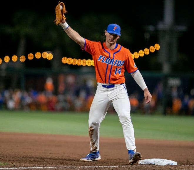 Gators utility Jac Caglianone (14) with the out at first in the bottom of the seventh inning against Texas Tech in NCAA Regionals, Sunday, June 4, 2023, at Condron Family Ballpark in Gainesville, Florida.  Florida beat Texas Tech 7-1 and advance to the Regional final game. [Cyndi Chambers/ Gainesville Sun] 2023
