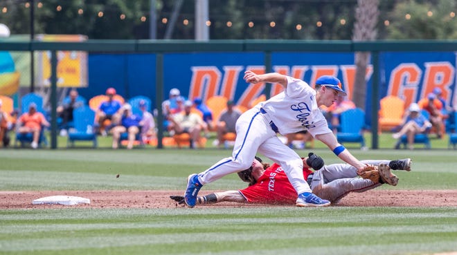 Gators infielder Cade Kurland (4) tags out Red Raiders outfielder Gage Harrelson (2) during the NCAA Regionals final, Monday, June 5, 2023, at Condron Family Ballpark in Gainesville, Florida. Florida beat Texas Tech 6-0 and advances to Super Regionals. [Cyndi Chambers/ Gainesville Sun] 2023
