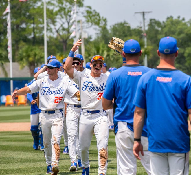 The Gators celebrate their win of the NCAA Regionals  game against Texas Tech, Monday, June 5, 2023, at Condron Family Ballpark in Gainesville, Florida. Florida beat Texas Tech 6-0 and advances to Super Regionals. [Cyndi Chambers/ Gainesville Sun] 2023