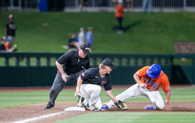 Gators utility Wyatt Langford (36) tagged out at third by Red Raiders Kevin Bazzell (4) in the top of the ninth in NCAA Regionals, Sunday, June 4, 2023, at Condron Family Ballpark in Gainesville, Florida. Florida beat Texas Tech 7-1 and advance to the Regional final game. [Cyndi Chambers/ Gainesville Sun] 2023