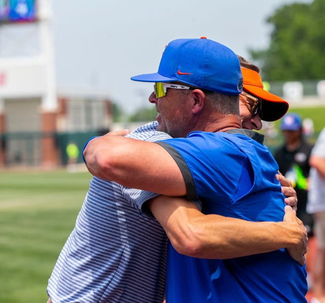 Florida head coach Kevin OÕSullivan celebrates the win of the NCAA Regionals game against Texas Tech with Florida Athletic Director Scott Stricklin, Monday, June 5, 2023, at Condron Family Ballpark in Gainesville, Florida. Florida beat Texas Tech 6-0 and advances to Super Regionals. [Cyndi Chambers/ Gainesville Sun] 2023