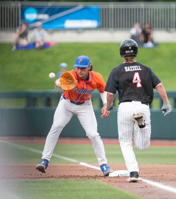 Gators utility Jac Caglianone (14) gets the throw at first for the out on Texas tech in NCAA Regionals, Sunday, June 4, 2023, at Condron Family Ballpark in Gainesville, Florida.  Florida beat Texas Tech 7-1 and advance to the Regional final game. [Cyndi Chambers/ Gainesville Sun] 2023
