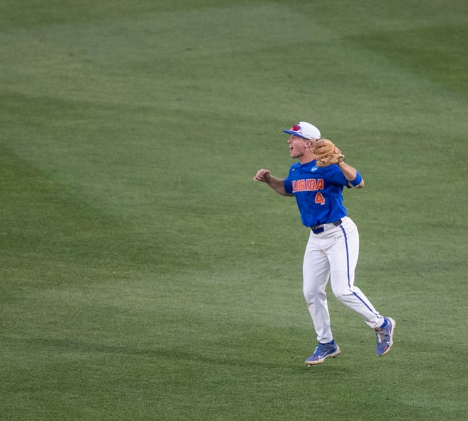 Gators infielder Cade Kurland (4) catches the ball for the last out and celebrates FloridaÕs win over South Carolina in Game 2 of the NCAA Super Regionals, Saturday, June 10, 2023, at Condron Family Ballpark in Gainesville, Florida. The Gators beat the Gamecocks 4-0 and are headed to the College World Series in Omaha.  [Cyndi Chambers/ Gainesville Sun] 2023