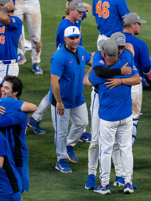 Gators pitcher Brandon Sproat (8) gives head coach Kevin OÕ Sullivan a hug in celebration of their win over South Carolina in Game 2 of the NCAA Super Regional,Saturday, June 10, 2023, at Condron Family Ballpark in Gainesville, Florida. The Gators beat the Gamecocks 4-0 and are headed to the College World Series in Omaha.  [Cyndi Chambers/ Gainesville Sun] 2023