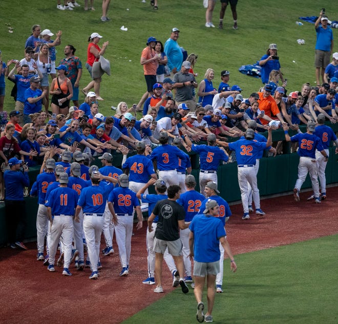 The Gators celebrate their win over South Carolina with fans in Game 2 of the NCAA Super Regional, Saturday, June 10, 2023, at Condron Family Ballpark in Gainesville, Florida. The Gators beat the Gamecocks 4-0 and are headed to the College World Series in Omaha.  [Cyndi Chambers/ Gainesville Sun] 2023