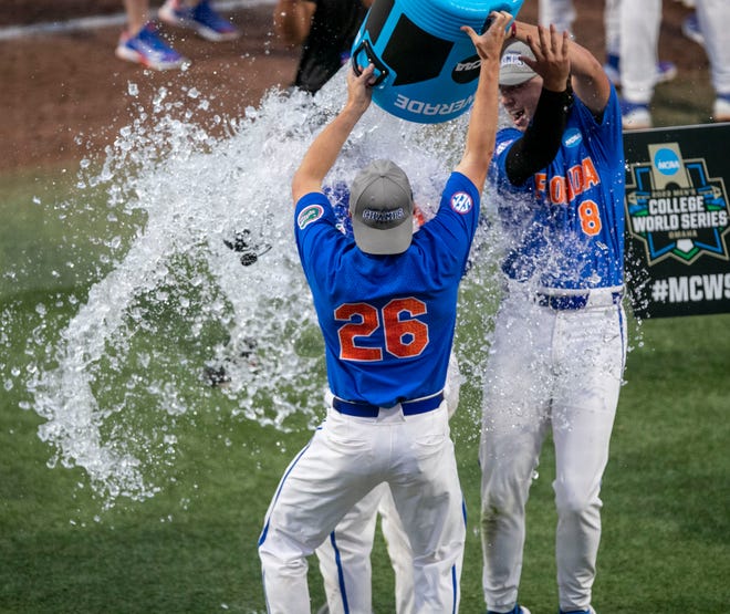 Gators pitcher Hurston Waldrep (12) gets a Powerade bath after Florida beat South Carolina in Game 2 of the NCAA Super Regional, Saturday, June 10, 2023, at Condron Family Ballpark in Gainesville, Florida. The Gators beat the Gamecocks 4-0 and are headed to the College World Series in Omaha.  [Cyndi Chambers/ Gainesville Sun] 2023