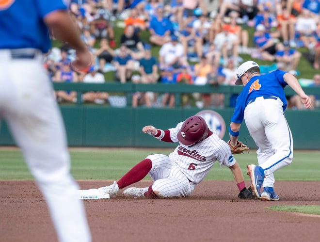 Gators infielder Cade Kurland (4) tags out Gamecocks infielder Will McGillis (6) in Game 2 of the NCAA Super Regionals,Saturday, June 10, 2023, at Condron Family Ballpark in Gainesville, Florida. The Gators beat the Gamecocks 4-0 and are headed to the College World Series in Omaha.  [Cyndi Chambers/ Gainesville Sun] 2023
