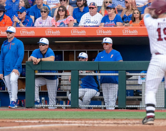 Florida head coach Kevin OÕSullivan watches the game from the Gator dugout in Game 2 of the NCAA Super Regional against Florida, Saturday, June 10, 2023, at Condron Family Ballpark in Gainesville, Florida. The Gators beat the Gamecocks 4-0 and are headed to the College World Series in Omaha.  [Cyndi Chambers/ Gainesville Sun] 2023