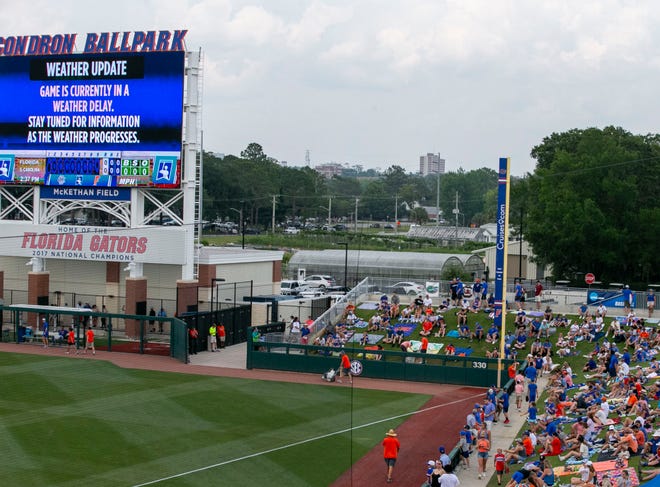 Fans on the berm for Game 2 of NCAA Super Regionals between the Gators and Gamecocks had to wait for the start of the game due to a weather delay, Saturday, June 10, 2023, at Condron Family Ballpark in Gainesville, Florida. [Cyndi Chambers/ Gainesville Sun] 2023