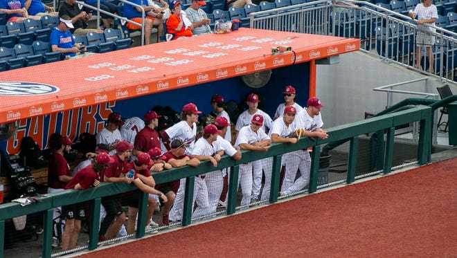 South Carolina players wait in the dugout before the start of Game 2 of NCAA Super Regionals against the Gators due to a weather delay, Saturday, June 10, 2023, at Condron Family Ballpark in Gainesville, Florida. [Cyndi Chambers/ Gainesville Sun] 2023