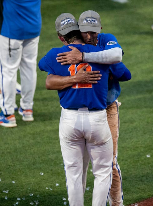 Gators pitcher Hurston Waldrep (12) and Gators infielder Josh Rivera (24) celebrate their win over South Carolina in Game 2 of the NCAA Super Regional, Saturday, June 10, 2023, at Condron Family Ballpark in Gainesville, Florida. The Gators beat the Gamecocks 4-0 and are headed to the College World Series in Omaha.  [Cyndi Chambers/ Gainesville Sun] 2023